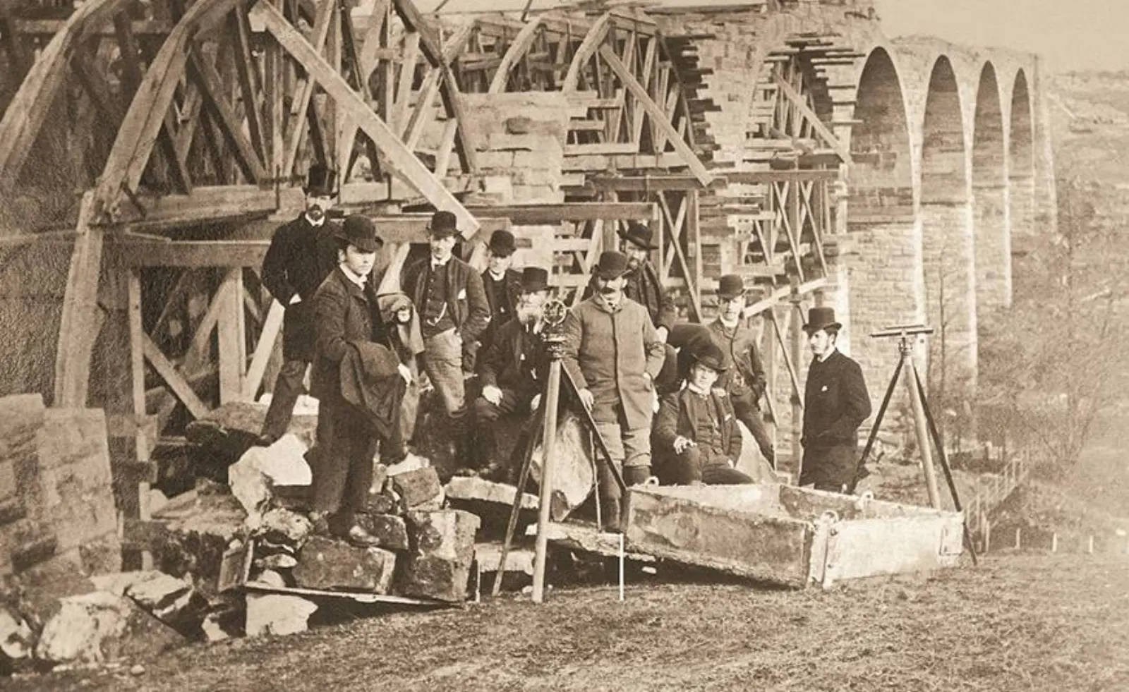 An archive photograph of Sir Robert McAlpine’s team beneath a viaduct under construction